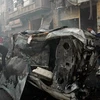 Hiện trường một vụ đánh bom xe ở Homs, Syria. (Nguồn:　AFP/TTXVN