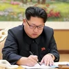 Nhà lãnh đạo Triều Tiên Kim Jong-Un ký sắc lệnh về việc thử bom H, tại Bình Nhưỡng. (Nguồn: AFP/TTXVN)