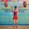 VĐV Thạch Kim Tuấn thi ở cử đẩy đạt 156kg tại SEA Games 27. (Ảnh: Thanh Hà/TTXVN)
