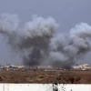 Khói bốc lên trong một cuộc giao tranh ở ngoại ô phía nam Tikrit của Iraq ngày 30/3. (Nguồn: AFP/TTXVN)