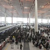Hành khách đợi các chuyến bay tại sân bay Bắc Kinh. (Nguồn: AFP/TTXVN)