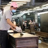 Dây chuyền sản xuất sản phẩm gỗ của Công ty TNHH Công nghiệp gỗ Kaiser Việt Nam tại Khu công nghiệp Mỹ Phước 1, thị xã Bến Cát. (Ảnh: Quách Lắm/TTXVN)