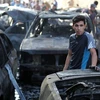 Hiện trường một vụ đánh bom xe tại Iraq. (Nguồn: AFP/TTXVN)
