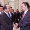 Phó Thủ tướng Chính phủ Nguyễn Xuân Phúc đón và hội đàm với Phó Thủ tướng Quốc vụ viện Trung Quốc Trương Cao Lệ. (Ảnh: Thống Nhất/TTXVN)