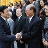Chủ tịch nước Trương Tấn Sang với các cán bộ Ngoại giao tiêu biểu qua các thời kỳ. (Ảnh: Nguyễn Khang/TTXVN)