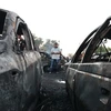 Những chiếc xe bị phá hủy sau vụ đánh bom ở Iraq ngày 15/8. (Nguồn: AFP/TTXVN)