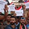 Người dân Iraq tuần hành tại thủ đô Baghdad, ủng hộ kế hoạch cải cách của Thủ tướng và phản đối nạn tham nhũng, dịch vụ công nghèo nàn và thiếu điện, ngày 9/8. (Nguồn: AFP/TTXVN)