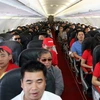 Hành khách trên tàu bay của Vietjet Air. (Ảnh: Huy Hùng/TTXVN)