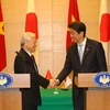 Tổng Bí thư Nguyễn Phú Trọng và Thủ tướng Nhật Bản Shinzo Abe sau khi kết thúc họp báo chung. (Ảnh: Trí Dũng/TTXVN)
