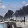 Khói bốc lên từ các cuộc không kích tại thị trấn Talbisseh, tỉnh Homs, Syria ngày 30/9. (Nguồn: AFP/TTXVN)