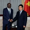 Phó Thủ tướng, Bộ trưởng Bộ Ngoại giao Phạm Bình Minh tiếp ông Mukhisa Kituyi, Tổng thư ký UNCTAD đang thăm và làm việc tại Việt Nam. (Ảnh: Phạm Kiên/TTXVN)