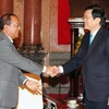 Chủ tịch nước Trương Tấn Sang tiếp Bộ trưởng Bộ Tư pháp Lào Bounkeut Sangsomsak đang thăm và làm việc tại Việt Nam. (Ảnh: Nguyễn Khang/TTXVN)
