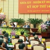 Chủ tịch Quốc hội Nguyễn Sinh Hùng dự và phát biểu tại phiên khai mạc kỳ họp lần thứ 14, Hội đồng nhân dân Thành phố Hà Nội khóa XIV, nhiệm kỳ 2011-2016. (Ảnh: Nhan Sáng/TTXVN)