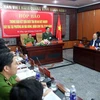 Đại tá Lê Văn Tam, Giám đốc Công an thành phố Đà Nẵng thông báo kết quả điều tra vụ án tại buổi họp báo. (Ảnh: Trần Lê Lâm/TTXVN)
