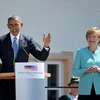 Thủ tướng Đức Angela Merkel (phải) và Tổng thống Mỹ Barack Obama phát biểu trong chuyến thăm làng Kruen, ngoại ô thành phố Garmisch-Partenkirchen, Đức ngày 6/7/2015. (Nguồn: AFP/TTXVN)