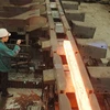 Cán phôi thép tại Nhà máy cán thép Thái Trung (Công ty Cổ phần Gang thép Thái Nguyên). (Ảnh: Hoàng Nguyên/TTXVN)