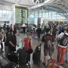 Hành khách đợi tại sân bay quốc tế Ngurah Rai tại Bali. (Nguồn: Reuters)