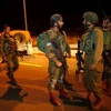 Binh sỹ Israel gác tại hiện trường một vụ đâm xe tại Khu Bờ Tây. (Nguồn: AFP/TTXVN)