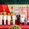 Chủ tịch nước Trần Đại Quang tới dự Lễ kỷ niệm 35 năm Ngày thành lập và trao Huân chương Quân công hạng Nhất cho Tổng cục Chính trị Công an nhân dân. (Ảnh: Nhan Sáng/TTXVN)