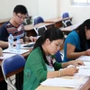 Các giáo viên chấm thi tại trường Đại học Sư Phạm TP. Hồ Chí Minh. (Ảnh: Phương Vy/TTXVN)