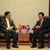 Phó Thủ tướng, Bộ trưởng Ngoại giao Phạm Bình Minh gặp Bộ trưởng Ngoại giao Lào Saleumxay Kommasith. (Ảnh: Phạm Kiên/TTXVN)