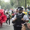 Cảnh sát Anh bảo vệ an ninh trong lễ hội Notting Hill. (Nguồn: EPA/TTXVN)