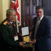 Thượng tướng Nguyễn Chí Vịnh làm việc với ông Alok Sharma, Quốc vụ khanh Bộ Ngoại giao Anh. (Ảnh do đoàn cung cấp)
