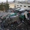 Xe tải chở hàng cứu trợ bị trúng bom tại Aleppo. (Nguồn: AFP/TTXVN)