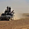Lực lượng Chính phủ Iraq trong chiến dịch truy quét IS tại Qayyarah, Mosul ngày 20/10. (Nguồn: AFP/TTXVN)