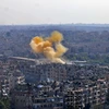 Khói bốc lên sau một vụ nã pháo của lực lượng đối lập tại thành phố Aleppo, Syria ngày 20/10. (Nguồn: AFP/TTXVN)