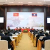 Hội thảo lý luận lần thứ 4 giữa Đảng Cộng sản Việt Nam và Đảng Nhân dân Cách mạng Lào. (Ảnh: Phạm Kiên/TTXVN)
