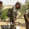 Lực lượng SDF tuần tra tại thị trấn Manbij ngày 10/6. (Nguồn: AFP/TTXVN)