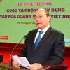 Thủ tướng Nguyễn Xuân Phúc đến dự và phát biểu tại Lễ phát động cuộc vận động xây dựng văn hóa doanh nghiệp. (Ảnh: Thống Nhất/TTXVN)