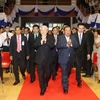 Tổng Bí thư Nguyễn Phú Trọng và Tổng Bí thư, Chủ tịch nước Lào Bounhang Volachith đến Trường Đại học Quốc gia Lào. (Ảnh: Trí Dũng/TTXVN)