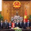 Thủ tướng Nguyễn Xuân Phúc với các đại biểu tại buổi tiếp. (Ảnh: Thống Nhất/TTXVN)