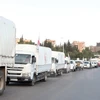 Một chuyến xe chở hàng cứu trợ tới thị trấn Madaya and al-Zabadani gần Damascus, Syria. (Nguồn: EPA/TTXVN)