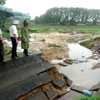 uyến kênh N6 hồ chứa nước Liệt Sơn, huyện Đức Phổ, Quảng Ngãi bị lũ phá hỏng. (Ảnh: Phước Ngọc/TTXVN)