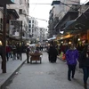 Cảnh yên bình của người dân Syria trên một tuyến phố ở Aleppo ngày 29/12. (Nguồn: EPA/TTXVN)
