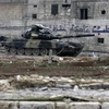 Xe quân sự Syria tại thị trấn al-Bab. (Nguồn: AP/TTXVN)