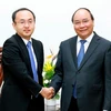 Thủ tướng Nguyễn Xuân Phúc tiếp ông Atsusuke Kawada, Trưởng đại diện Tổ chức Xúc tiến Thương mại Nhật Bản (JETRO) tại Hà Nội. (Ảnh: Thống Nhất/TTXVN)