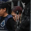 Nghi phạm Indonesia được an ninh Malaysia đưa ra tòa để nghe cáo trạng. (Nguồn: AFP)