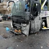 Chiếc xe buýt bị phá hủy tại hiện trường vụ đánh bom ở Damascus ngày 11/3. (Nguồn: EPA/TTXVN)