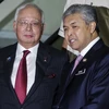 Thủ tướng Malaysia Najib Razak (trái) và Phó Thủ tướng Ahmad Zahid Hamidi sau cuộc họp khẩn Hội đồng An ninh quốc gia về căng thẳng với Triều Tiên ở Subang ngày 7/3. (Nguồn: EPA/TTXVN)