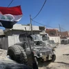 Các lực lượng chống khủng bố Iraq tiến vào Matahen, vùng lân cận thành phố Mosul trong chiến dịch giành lại quyền kiểm soát thành phố này từ phiến quân IS ngày 10/4. (Nguồn: AFP/TTXVN)