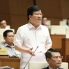 Phó Thủ tướng Trịnh Đình Dũng trả lời, làm rõ một số vấn đề Đại biểu Quốc hội nêu. (Ảnh: Phương Hoa/TTXVN)