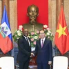 Chủ tịch nước Trần Đại Quang tiếp Chủ tịch Thượng viện Cộng hoà Haiti Youri Latortue đang có chuyến thăm chính thức Việt Nam. (Ảnh: Nhan Sáng/TTXVN)