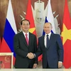 Chủ tịch nước Trần Đại Quang và Tổng thống Liên bang Nga Vladimir Putin bắt tay sau Lễ ký các văn kiện hợp tác giữa hai nước. (Ảnh: Nhan Sáng/TTXVN)