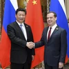 Chủ tịch Trung Quốc Tập Cận Bình và Thủ tướng Nga Dmitry Medvedev trong cuộc gặp năm 2015. (Nguồn: Xinhua)