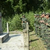Các chiến sỹ Bộ đội biên phòng Đồn Biên phòng Pa Thơm kiểm tra cột mốc 110, phân định ranh giới chủ quyền với nước bạn Lào. (Ảnh: Xuân Tiến/TTXVN)