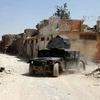 Xe quân sự Iraq trong chiến dịch chống khủng bố tại Mosul ngày 30/6. (Nguồn: EPA/TTXVN)